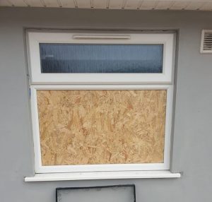 Boarded up window in Borehamwood